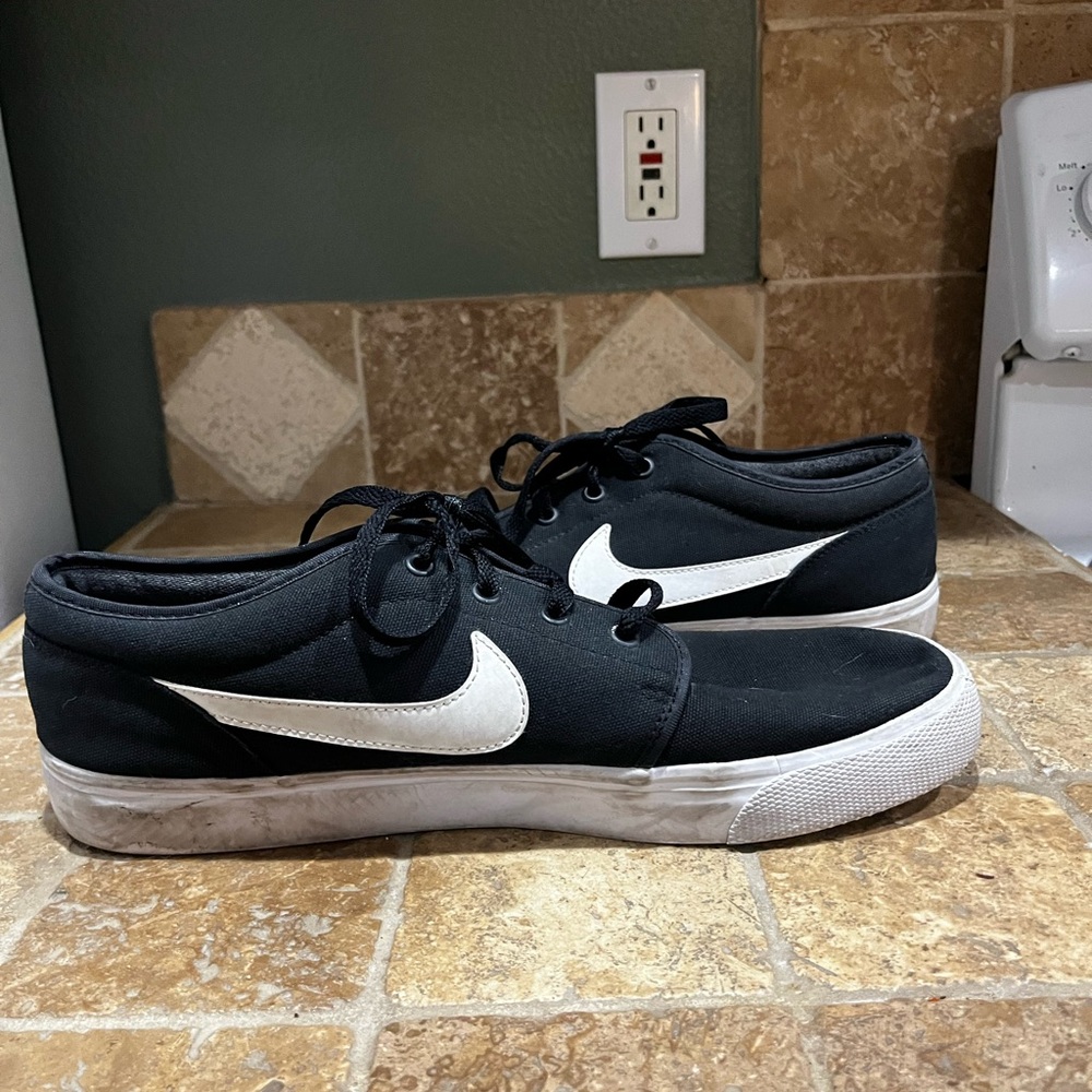 Nike Toki Low Triple Black Canvas with White Swoosh And Sole. Men’s 12